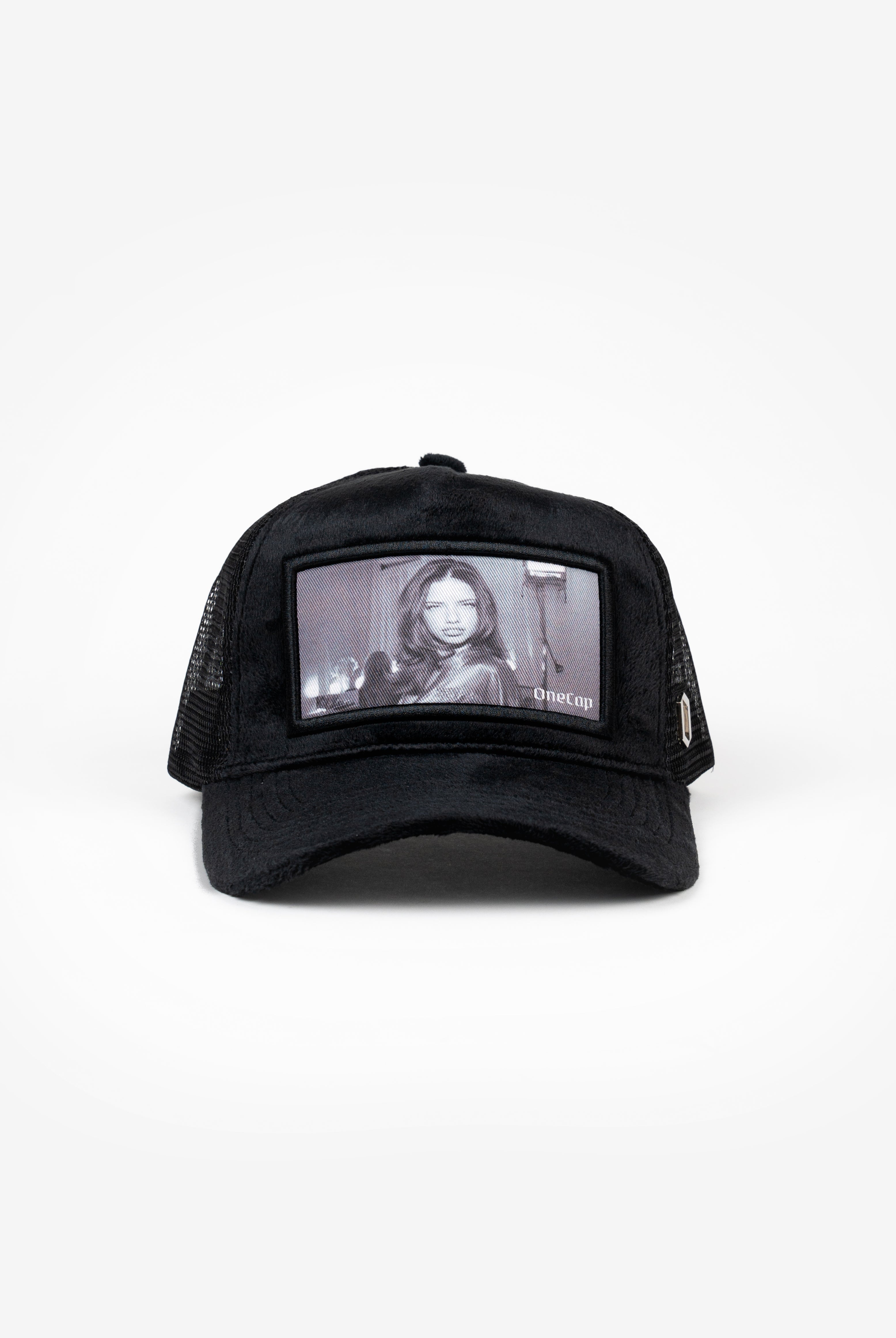 Black mesh cap featuring a photo of a famous model and actress on the front panel