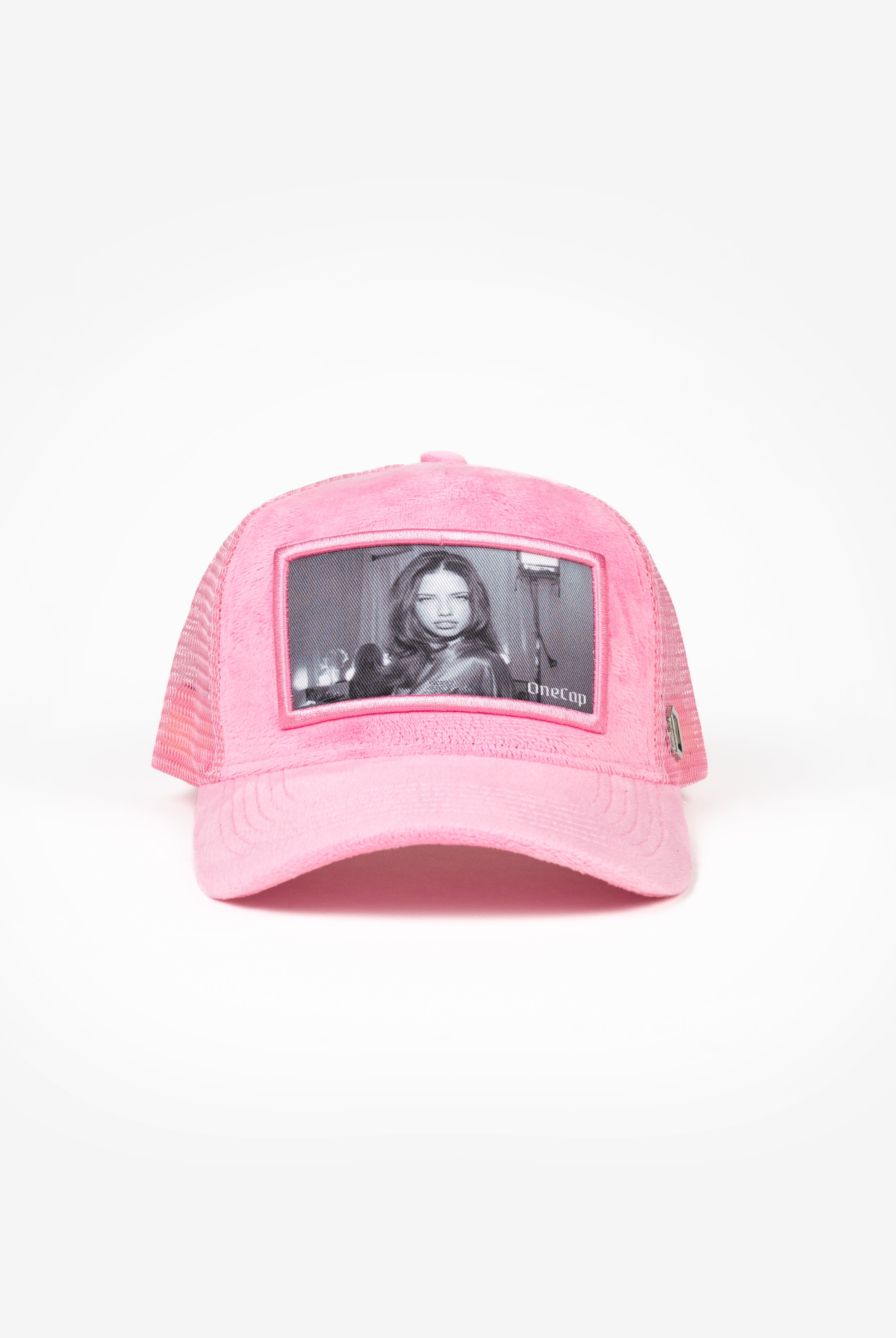 Pink baseball cap featuring a black-and-white image of a model in the front panel.