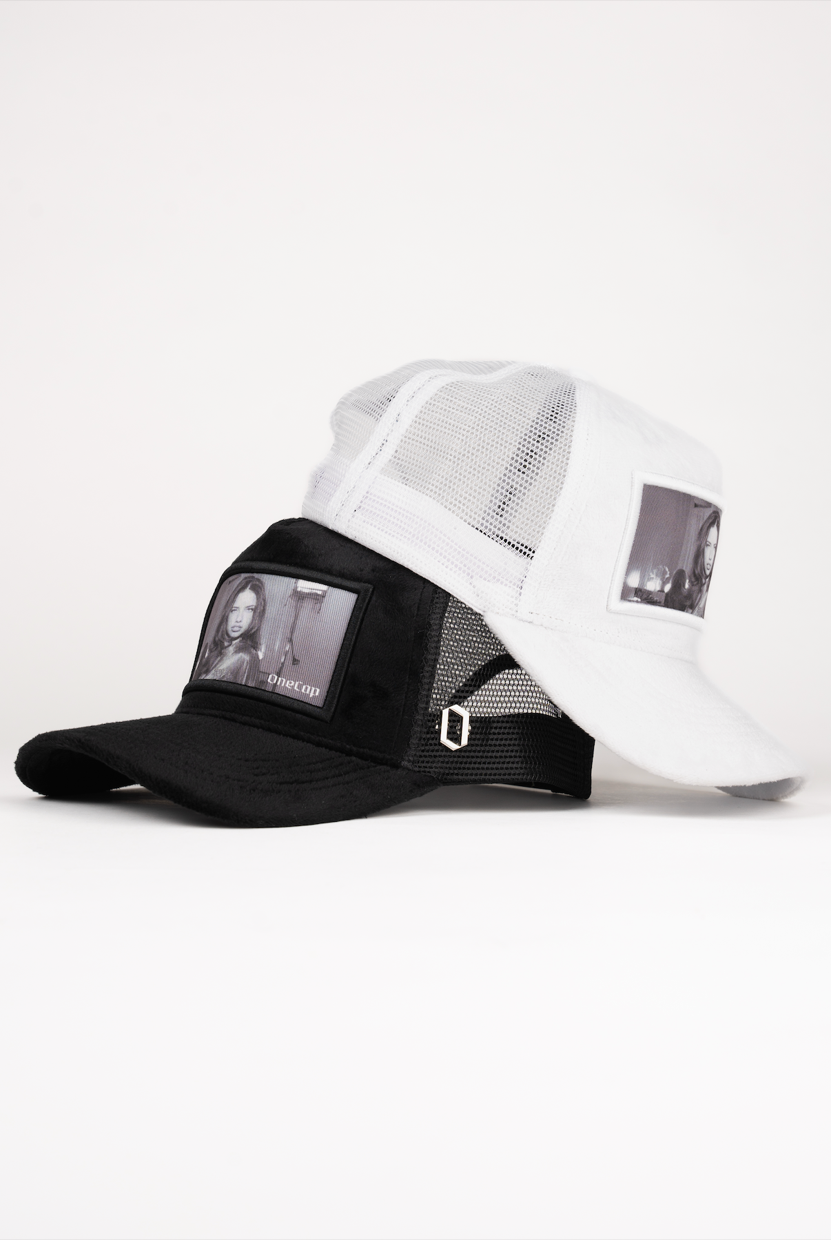 Black and white caps with Adriana Lima photos displayed on the front panels